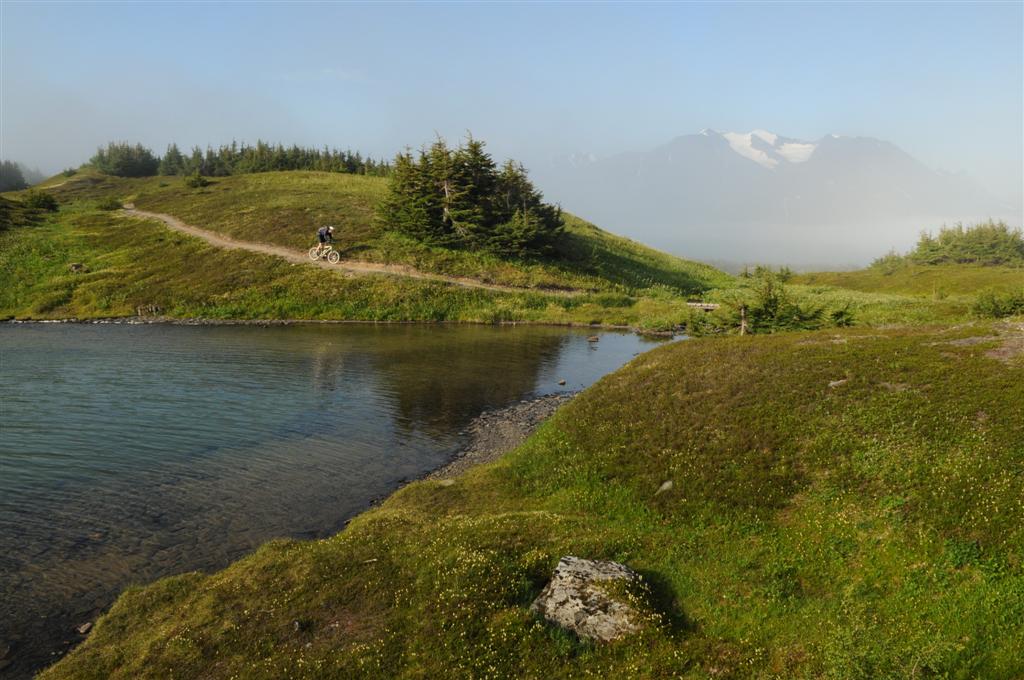 The trail wrapped around various small lakes that reflected the rugged scenery. 