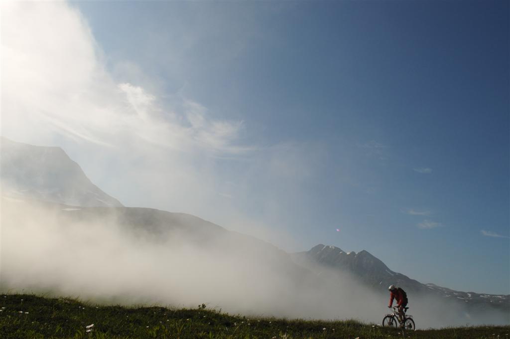 Mist swept in and out, revealing high peaks like a magician's flourish. 