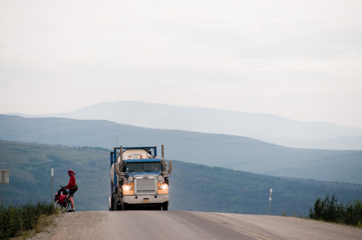 The best tactic is to pull over. Trucks CB radio to each other if there's a cyclist on the road, and get to know where you'll be every day. 