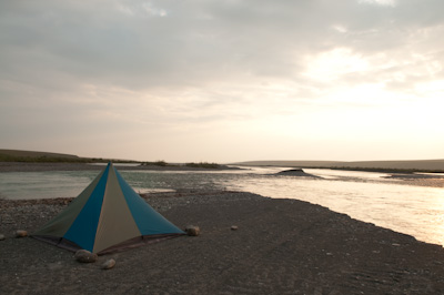 Our campspot at Happy Valley. It looks scenic enough. Behind, there's a road crew camp, a helicopter and piles of gravel. 