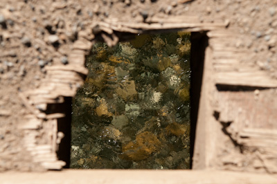 Crystal clear water through a hole in a bridge. 