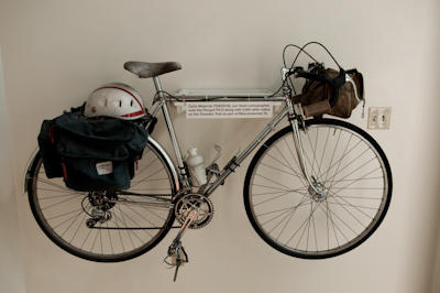 Variois touring bikes have found their retirement on the office walls, including one of legendary Kiwi traveller XXX. 