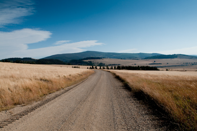 A helping tailwind propelled me along the gravel road, into the late afternoon haze of the ridgetop. 