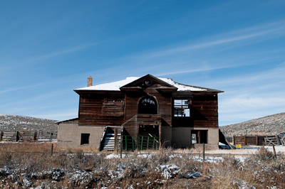 Lots of dilapidated, abandoned houses by the roadside. 